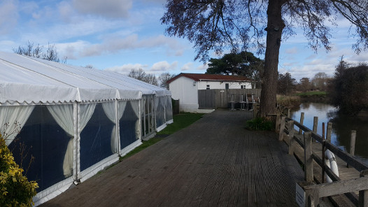 Riverside wedding marquee and terrace